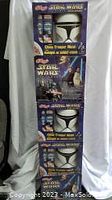 Five sealed Kellogg's Star Wars Episode 2 Clone Trooper masks stacked vertically showing front of boxes with mask frontier and character images.