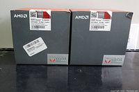 Lot contains two AMD Ryzen 5 2400G processor boxes with visible labels and AMD branding.