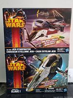 Front view of two Star Wars sets boxes stacked showing Obi-Wan Jedi Starfighter and Jango Fett Slave I, highlighting original packaging and missile launcher feature.
