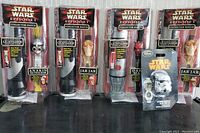 All collector watches and lighted window decors in original packaging displayed on surface.