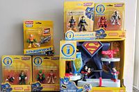 Overall lot showing Superman playset and all packaged figurines surrounding it