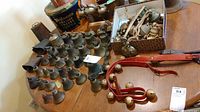 Tabletop display of multiple small metal skirted bells