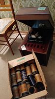 Box containing multiple Edison Blue Amberol cylinder record containers