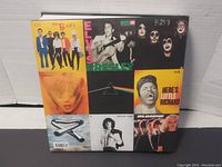 Front cover of the book showing collage of album covers from artists like The Beatles, Elvis Presley, Pink Floyd, Blondie, etc.
