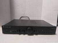 Front view powered on showing all front-panel controls and LED indicator.