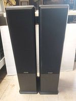 Front view of both speakers with grille covers installed