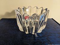 Front angled view of clear crystal tulip top bowl with Orrefors Sweden sticker visible.