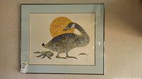 Full view of the framed print showing goose with goslings and sun motif