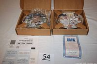 Two Bradford Exchange Immortals of the Diamond plates in boxes with Certificates of Authenticity laid next to plates.