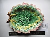 Top view of the oak leaf bread tray showing detailed glaze colors and leaf form, including pink edges and green/yellow leaf texture