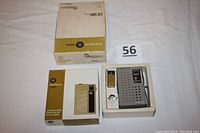 Vintage Westinghouse portable radio set with original box and outer box, shown in white cloth background with lot number card.