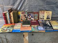 Overview of 21 Canadian literature and poetry books displayed on a table, showing variety of titles and authors.