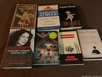 Seven Margaret Atwood books displayed, including both hardcover and paperback editions.