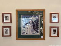 Full view of the set of Native American wall art including one large framed print in center and four smaller framed prints surrounding it.