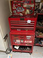 Front view of red Craftsman top tool chest and bottom rolling cabinet against wall