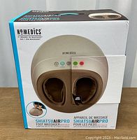 Front view of Homedics Shiatsu Air Pro Foot Massager box showing product image and branding.
