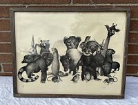 Framed black and white print showing a group of various animals including giraffe, bear, raccoon, koala, lemur, and several smaller animals.