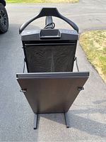 Front view of black Corby 7700 trouser press showing the padded pressing area and sturdy base.