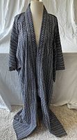 Front view of Japanese unisex cotton kimono showcasing black and white geometric vertical stripe pattern and wide open front design.