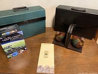 Photo showing expanding files, bird bookends, and DVD set box