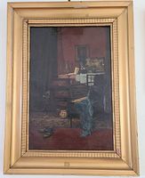Full view of the framed oil painting depicting an interior still life with a desk, table, chair, vessels and drapery, showing gilt wooden frame