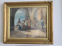 Framed watercolour painting of figural scene beneath an archway by the water, signed lower right.