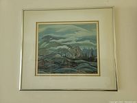 Photo of framed print artwork by A. J. Casson titled "Fog Clearing" showing landscape scene with cloudy sky, hills, and trees in muted colors.