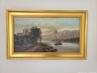 Front view of the framed oil painting showing river scene with boat and buildings. Visible hole in the canvas on the right side.