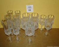 Full view of the 14 piece cut crystal stemware lot showing varying heights and intricate cuts