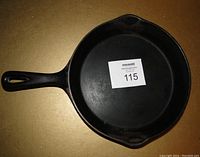 Top view of the cast iron fry pan showing the cooking surface and handle.