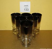 Six Dorothy Thorpe silver fade tall drinking glasses arranged in a triangular stack, showing their height and fade detail.