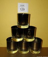 Six stacked vintage Dorothy Thorpe whiskey glasses with silver fade, showing overall look and size