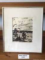 Full view of framed black and white art piece with matting, showing the lake and forest impressionistic scene.