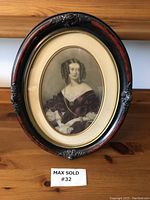 Front view of the vintage framed Lady Frances Fletcher portrait showing overall condition, oval wood frame with decorative floral accents, and the detailed portrait of the lady wearing period gown and gloves.