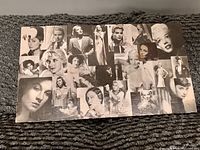 Top view of the rectangular wood panel with black and white photo collage showing multiple classic Hollywood actresses with some visible scuffs