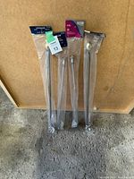 Three brand new, still sealed curtain rods, two Levolor and one Allison, silver finish, adjustable from 20-48 inches.
