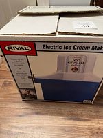 Original packaging box showing the Rival Electric Ice Cream Maker with product image and description.