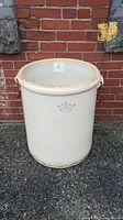 Front perspective showing the full cream-colored stoneware crock with blue crown logo and number 20.