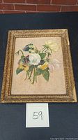 Full view of the framed floral still life oil painting on canvas, showing the entire bouquet of flowers and ornate frame.