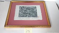Woodblock print framed under glass, showing the full artwork and frame.