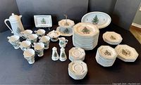 Full spread of Christmastime pattern dishes and serving pieces
