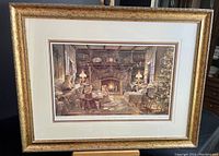 Full view of framed and matted limited edition print showing detailed Christmas cottage scene with children and fireplace.
