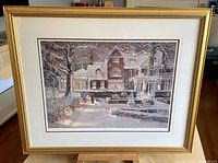 Front view of framed print depicting a snow-covered estate scene