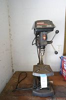 Full image of the Craftsman drill press showing base, table, and upper motor housing with model information and power switch.