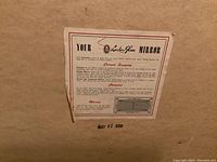 Back of the mirror showing original London Glass label with hanging, cleaning, and mounting instructions, stamped May 27, 1950.