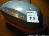 Close-up photo of the polisher top showing the General Electric logo and CTRI model marking on the silver-gray metal casing with red trim.