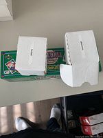 Photo of two white card storage boxes and a green Sports Illustrated 1992 Baseball Complete Edition binder on a table.