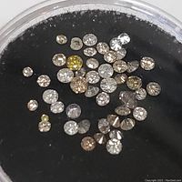 Another close-up image with focus on the yellow and brown diamonds among the white diamonds.