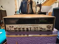 Front view of vintage Sony STR-6036A receiver showing control knobs and display panel.