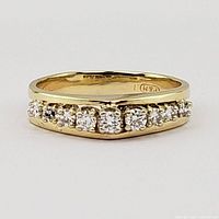 Straight-on front view showing nine diamonds across the chevron-shaped band